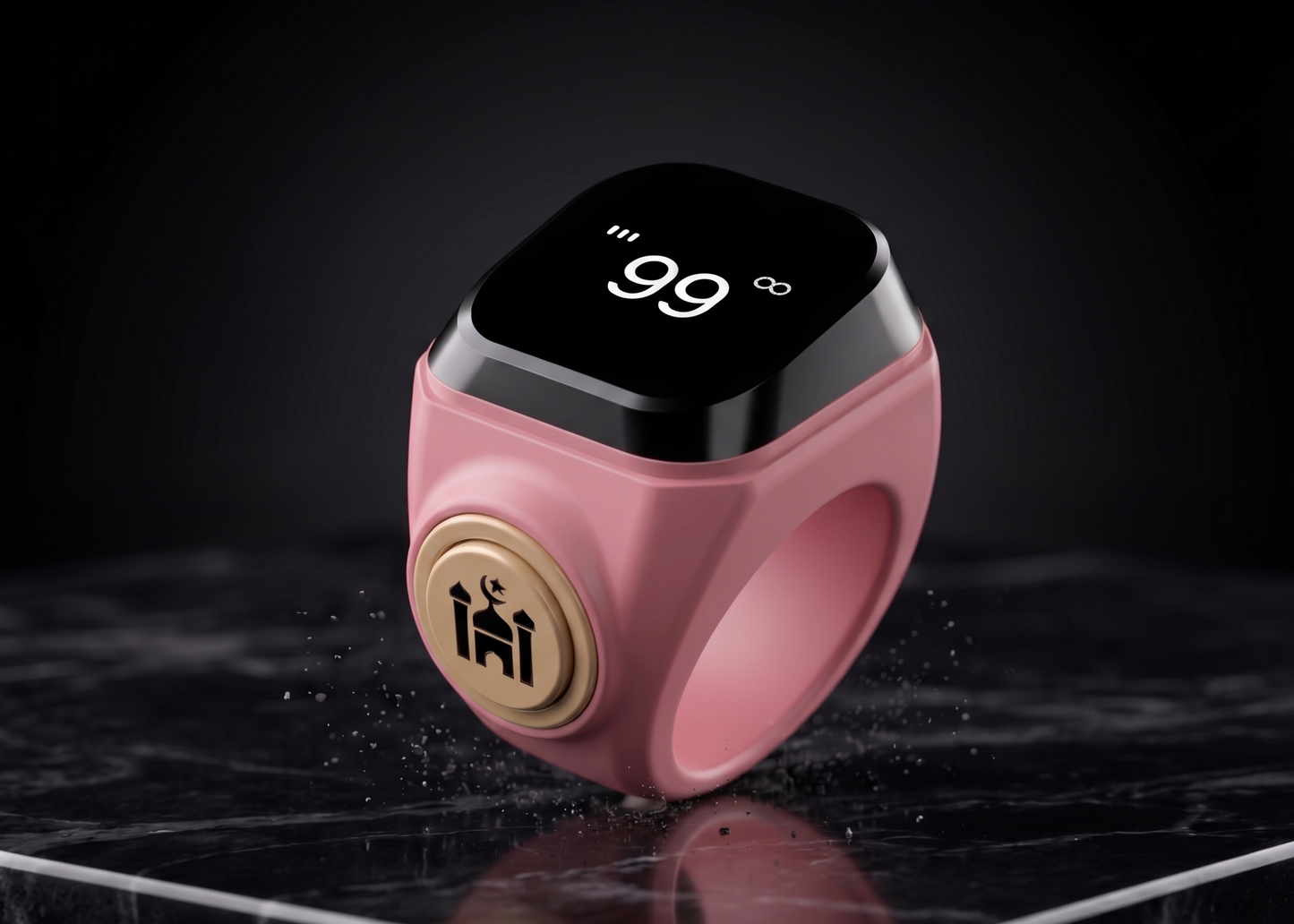 Qamar ring in pink with a digital display showing 99, showcasing a modern and stylish design on a marble surface.