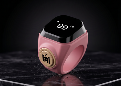 Qamar ring in pink with a digital display showing 99, showcasing a modern and stylish design on a marble surface.
